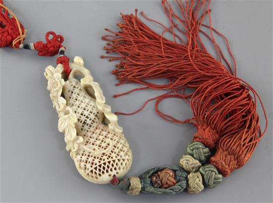 A Chinese ivory perfumier, 18th/19th century, length 7.3cm, suspended with silk cords and tassels